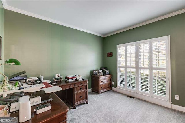 office space with ornamental molding, light colored carpet, visible vents, and baseboards