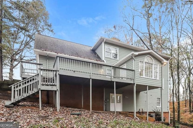 145 Price Hills Ct, Sugar Hill, GA 30518 - back of house with a wooden deck, stairway, and roof with shingles