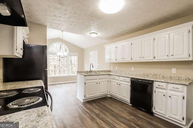 145 Price Hills Ct, Sugar Hill, GA 30518 - kitchen with dishwasher, freestanding refrigerator, a peninsula, a textured ceiling, and dark wood-type flooring