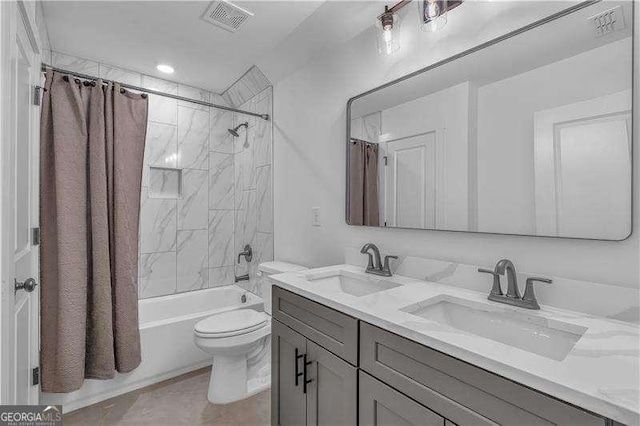 bathroom featuring shower / tub combo, visible vents, toilet, and a sink