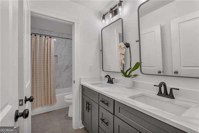 full bathroom with double vanity, shower / bathtub combination with curtain, toilet, and a sink
