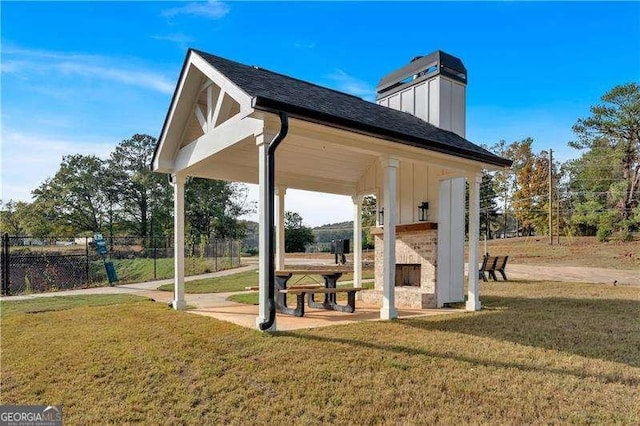 view of property's community with a yard and fence