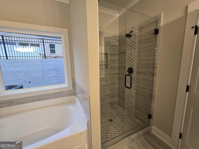 bathroom featuring plus walk in shower