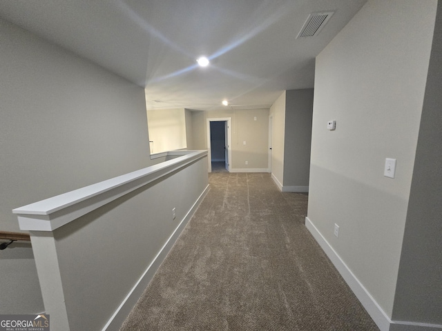 hallway with carpet flooring