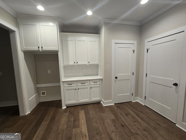 interior space with crown molding and dark hardwood / wood-style floors