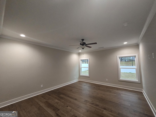 spare room featuring dark hardwood / wood-style flooring, crown molding, and ceiling fan