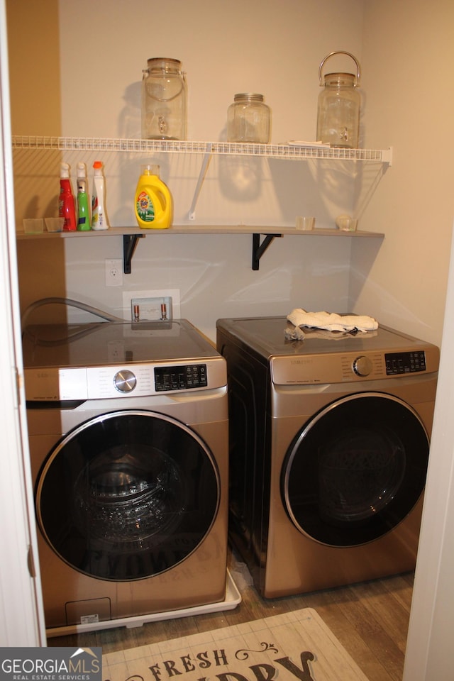 washroom featuring separate washer and dryer and light wood-type flooring