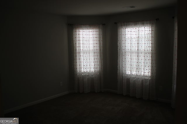 unfurnished room with carpet floors