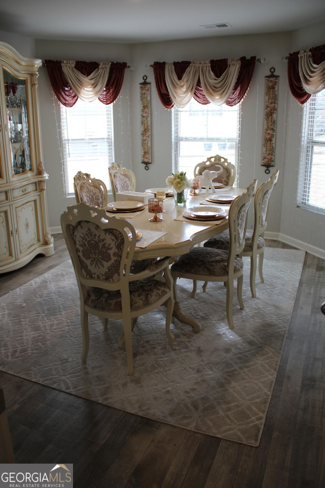 dining space featuring hardwood / wood-style floors