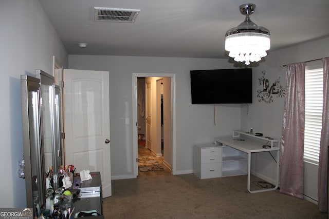 office area featuring a notable chandelier and carpet flooring