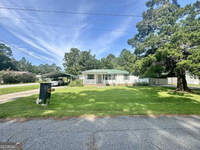 view of front of property with a carport, a porch, and a front lawn