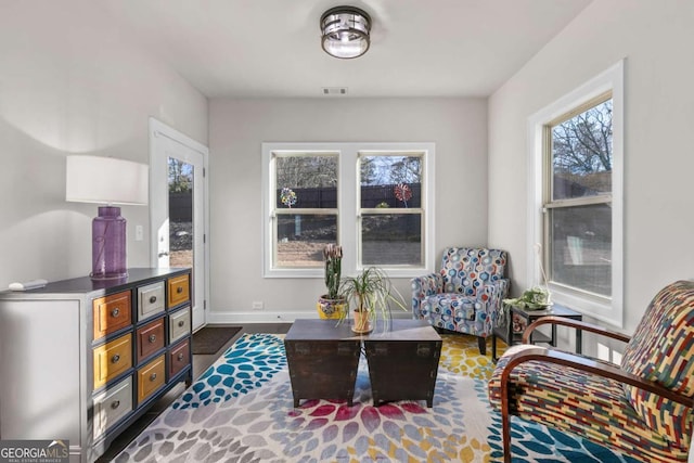 sitting room featuring baseboards and visible vents