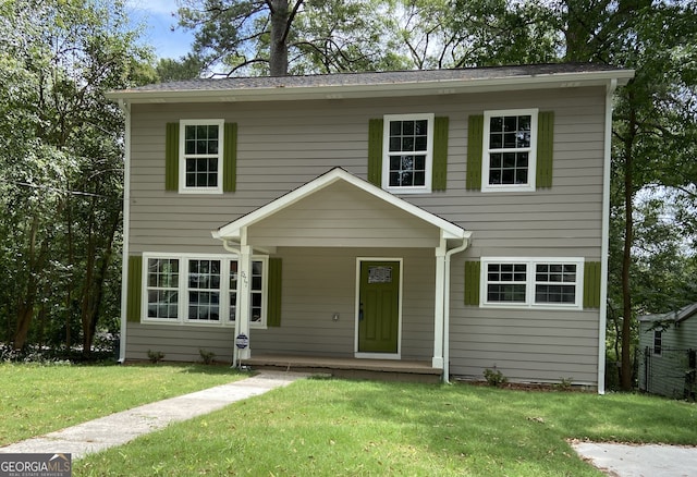 view of front of home with a front lawn and covered porch