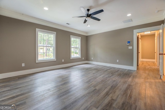 unfurnished room featuring hardwood / wood-style flooring, ornamental molding, and ceiling fan