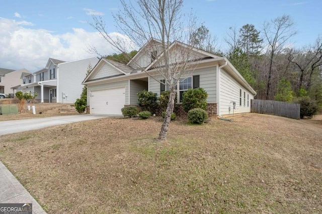 view of front of house with a garage and a front yard