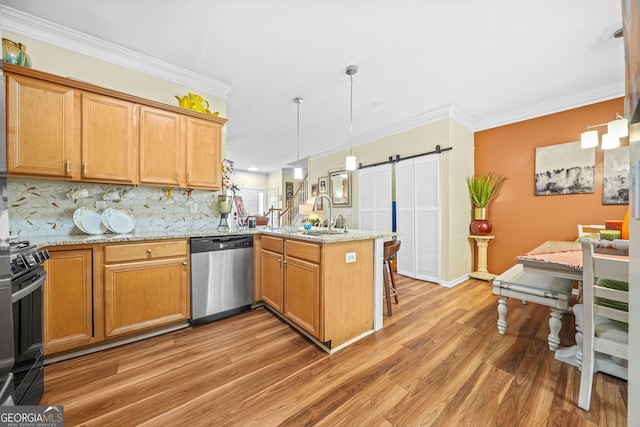 kitchen with electric range oven, light stone counters, kitchen peninsula, stainless steel dishwasher, and a barn door