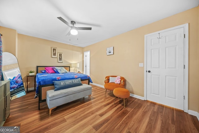 bedroom featuring wood-type flooring and ceiling fan