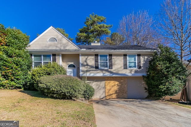 5876 Old Wellborn Trce, Lithonia, GA 30058 - bi-level home featuring a front yard and a chimney