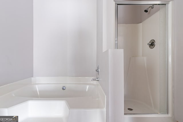 5876 Old Wellborn Trce, Lithonia, GA 30058 - bathroom featuring a stall shower and a bath