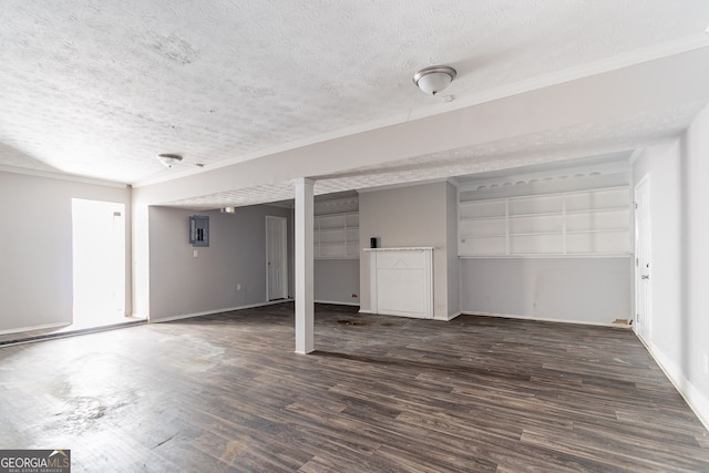 5876 Old Wellborn Trce, Lithonia, GA 30058 - unfurnished living room featuring a textured ceiling, wood finished floors, electric panel, and crown molding