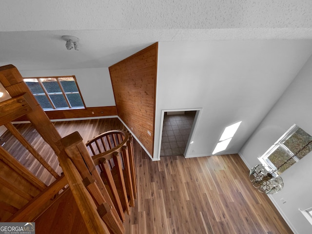 foyer entrance featuring wood-type flooring and a textured ceiling