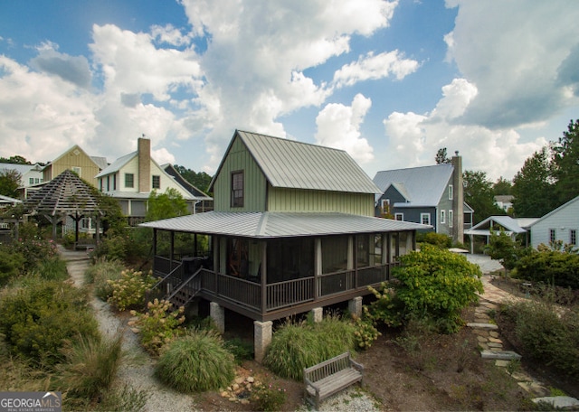 view of front facade with metal roof and board and batten siding