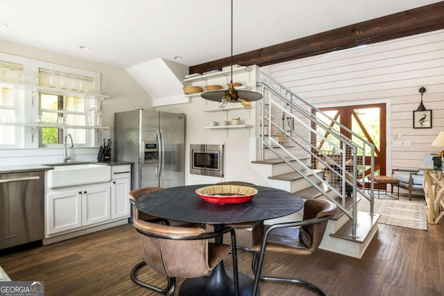 dining room with sink and dark hardwood / wood-style flooring