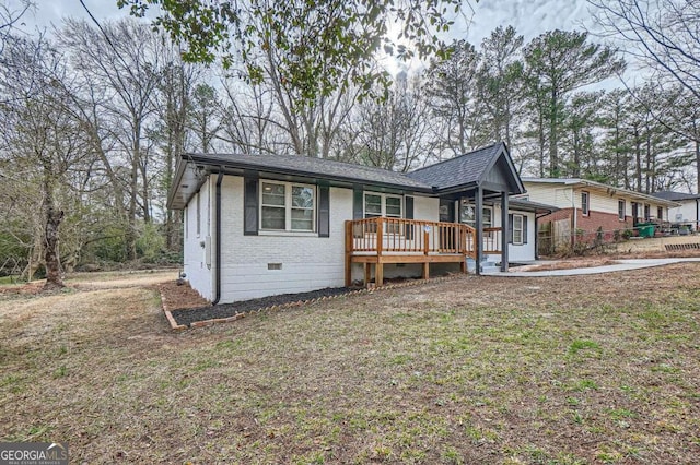 view of front of property featuring a shingled roof, crawl space, and brick siding