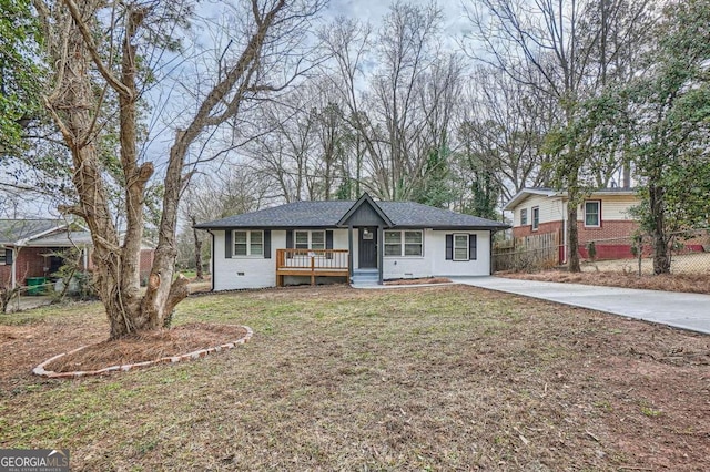 ranch-style home with a porch and a front yard