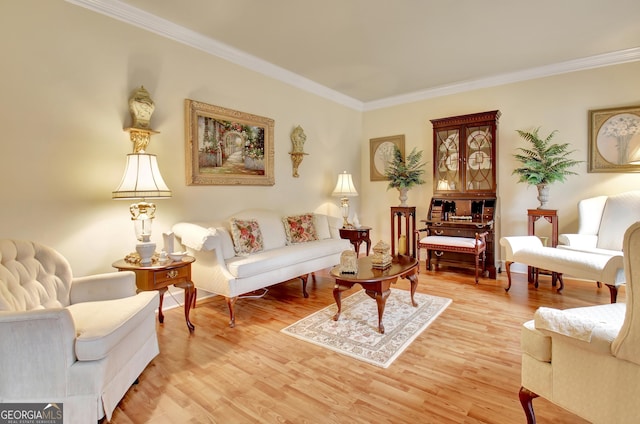 living room with hardwood / wood-style flooring and crown molding