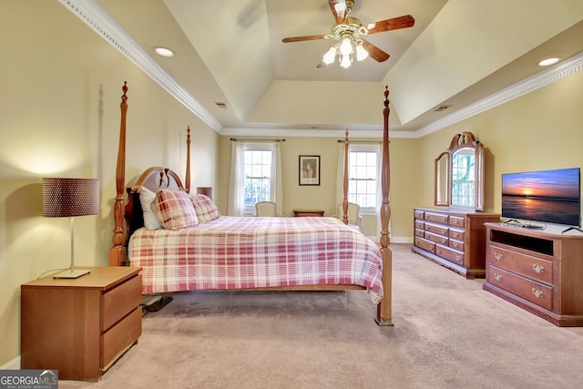 carpeted bedroom with crown molding, a raised ceiling, and ceiling fan