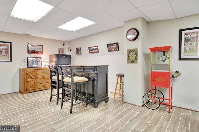 bar with a paneled ceiling