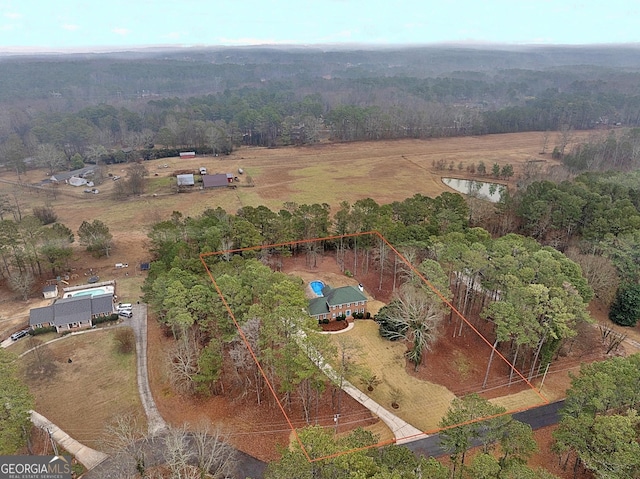 birds eye view of property featuring a rural view