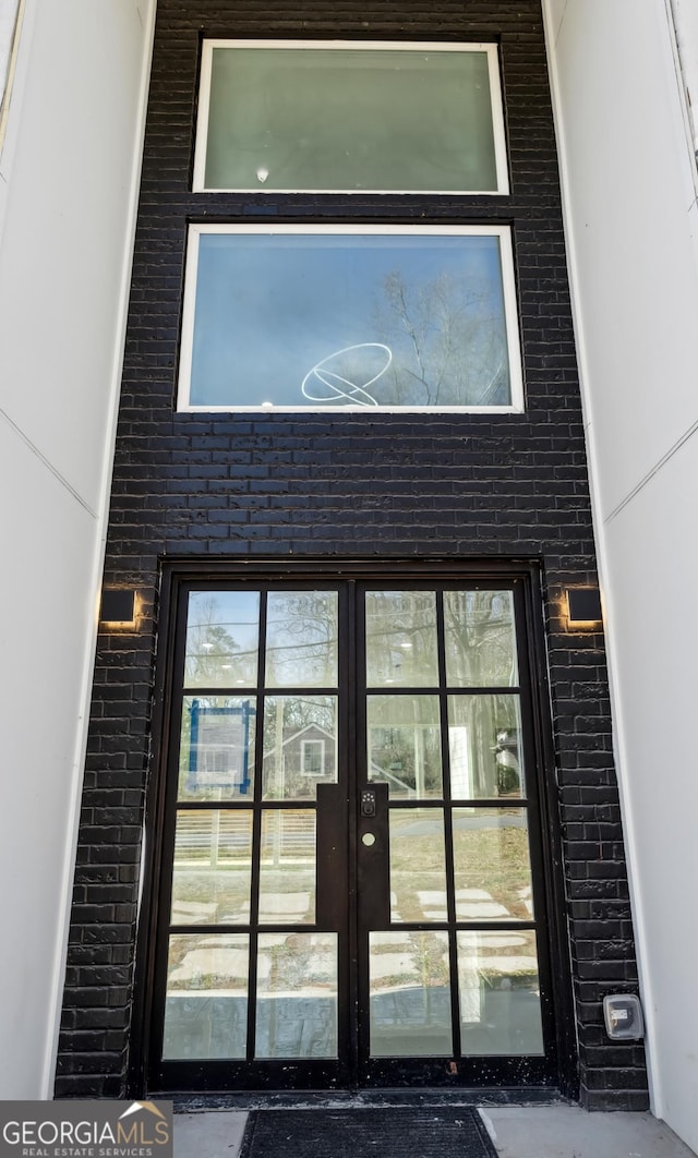 property entrance featuring french doors