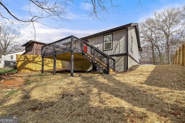 rear view of house featuring a deck