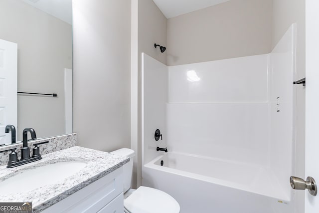 full bathroom with shower / bathtub combination, vanity, and toilet