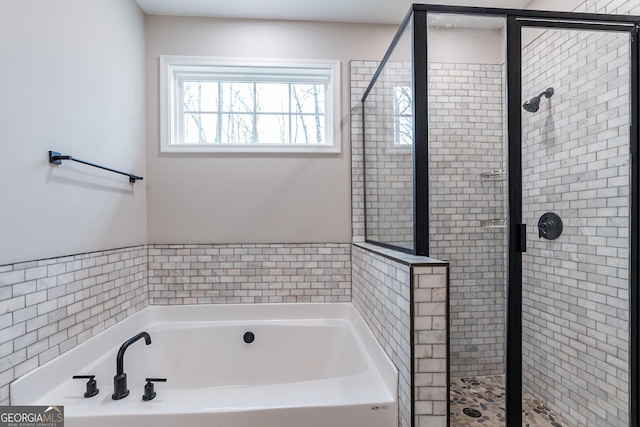 bathroom with separate shower and tub