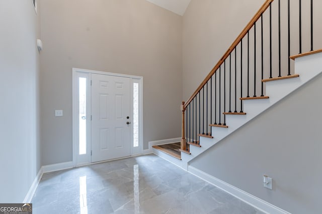 foyer featuring a high ceiling