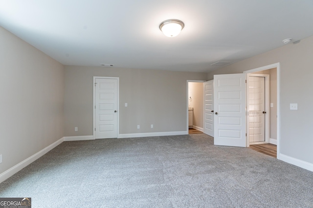 unfurnished room with carpet floors