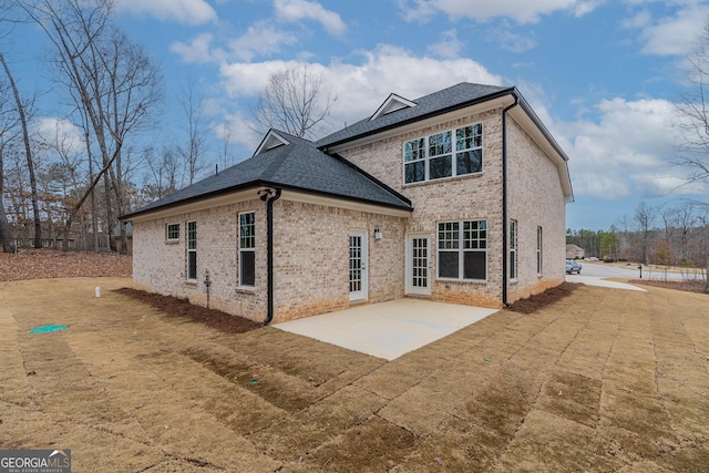 rear view of property featuring a patio