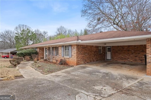 ranch-style house with a carport