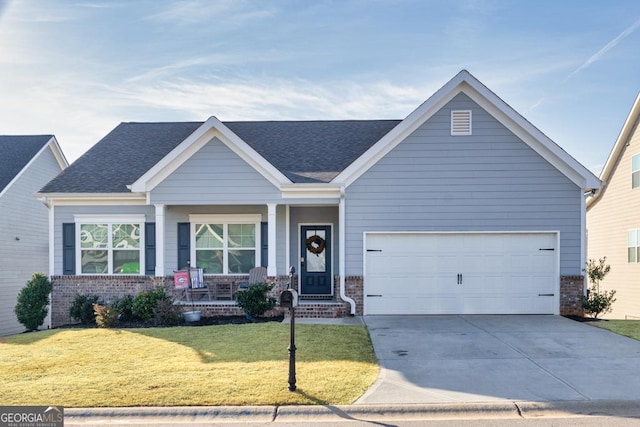 view of front of house featuring a front lawn, concrete driveway, a shingled roof, a garage, and brick siding