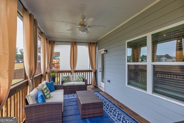 sunroom featuring ceiling fan