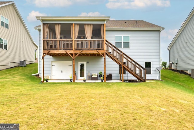 rear view of property featuring central air condition unit, a lawn, a patio, stairway, and a sunroom