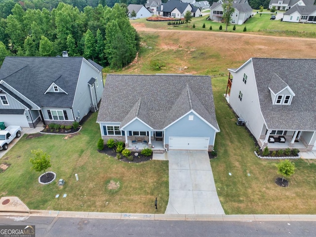 birds eye view of property with a residential view