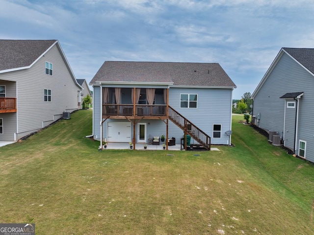back of house featuring a patio, central AC, a sunroom, stairs, and a lawn