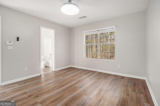 unfurnished room featuring light hardwood / wood-style flooring