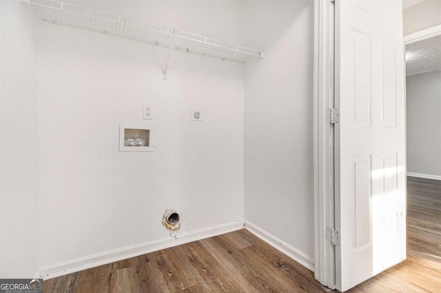 washroom featuring electric dryer hookup, hardwood / wood-style floors, and hookup for a washing machine