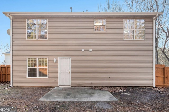 rear view of property featuring a patio area