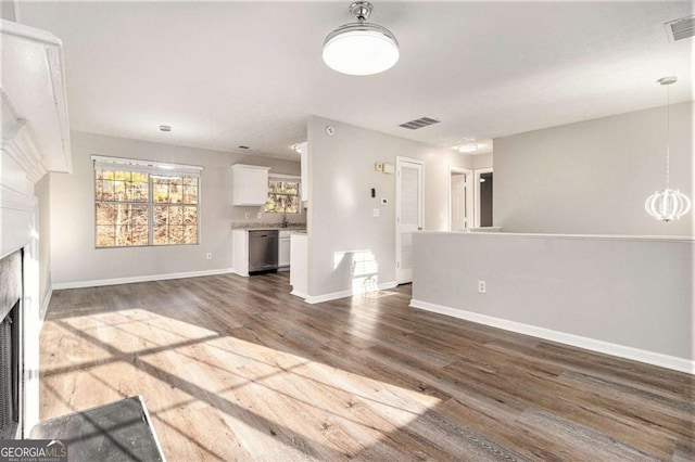 unfurnished living room featuring dark wood-type flooring